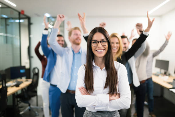 Portrait of group of successful businesspeople happy at work