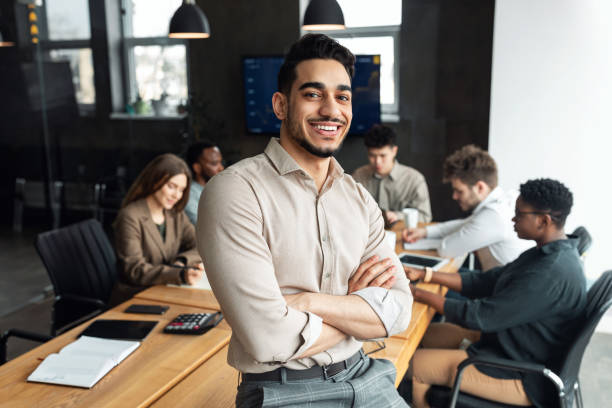 Portrait of group of successful businesspeople happy at work