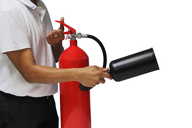 A man showing how to use fire extinguisher isolated over white background