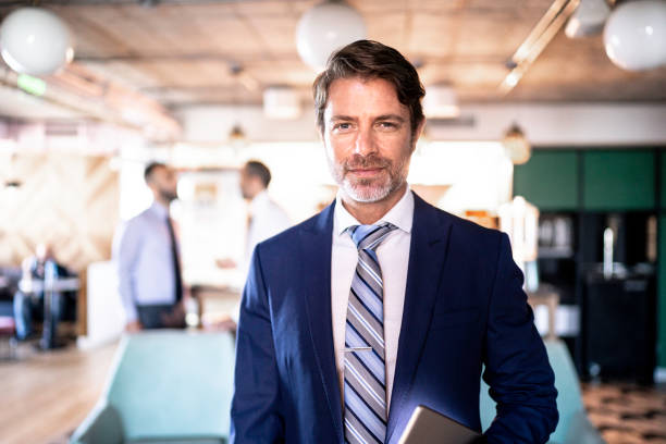 Businessman outside his office in Barcelona. Selective focus on man.